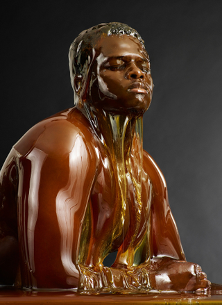 Illustration for article titled Amazing photos of naked people completely covered in honey (NSFW)